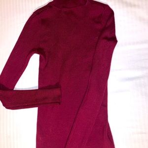 Waste slimming turtleneck.